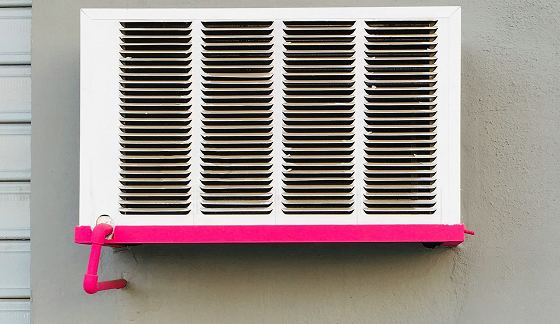 An air conditioning Unit with bright pink bottom