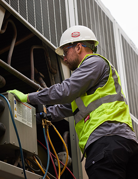 A Technician fixing the HVAC system